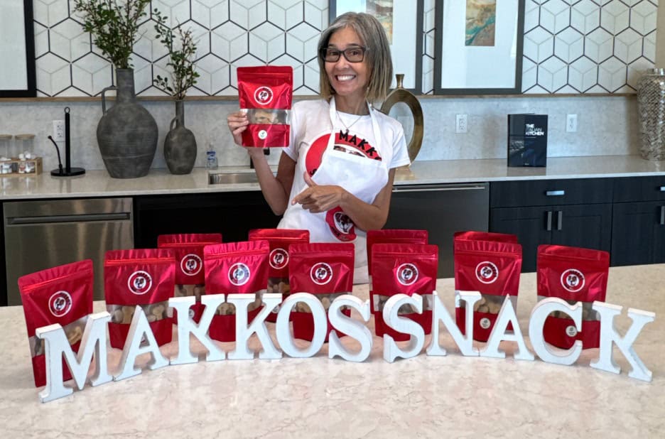Makko’s Snack team at their dog bakery in San Antonio, Texas, presenting natural dog birthday cakes made with love and healthy ingredients.